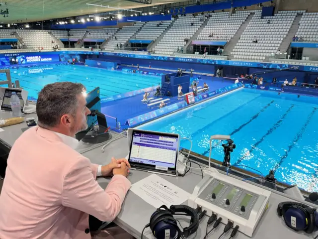 Fred Sirieix watches the diving warm-ups