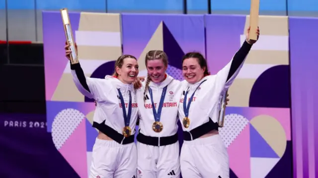 Katy Marchant, Sophie Capewell and Emma Finucane celebrating their women's team sprint cycling gold