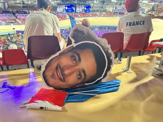 A cardboard cut-out of Rayan Helal's face