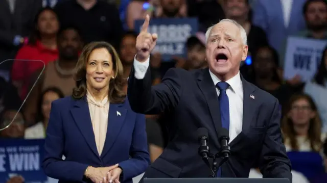 U.S. Vice President and Democratic presidential candidate Kamala Harris stands next to her newly chosen vice presidential running mate Minnesota Governor Tim Walz as he speaks during a campaign rally in Philadelphia, Pennsylvania, U.S., August 6, 2024.