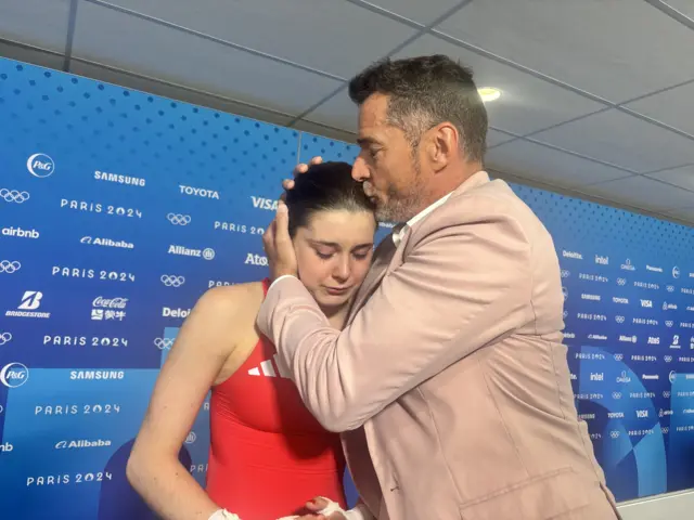 Olympics diver Andrea Spendolini Sirieix is hugged by dad Fred Sirieix