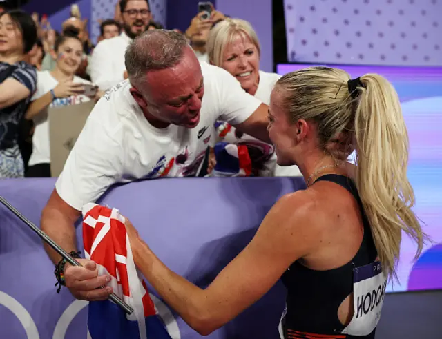 Gold medalist Keely Hodgkinson of Team Great Britain celebrates with her father Dean Hodgkinson