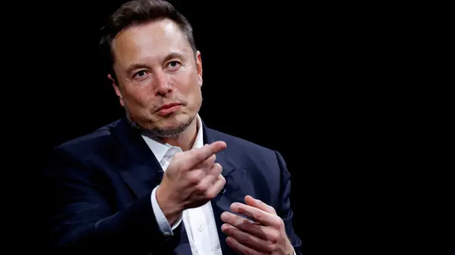 Elon Musk gestures