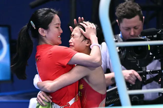 Hongchan celebrates winning gold in the women's 10m platform final