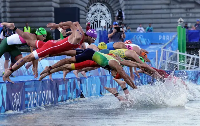 Athletes diving into the Seine during the Olympic triathlon