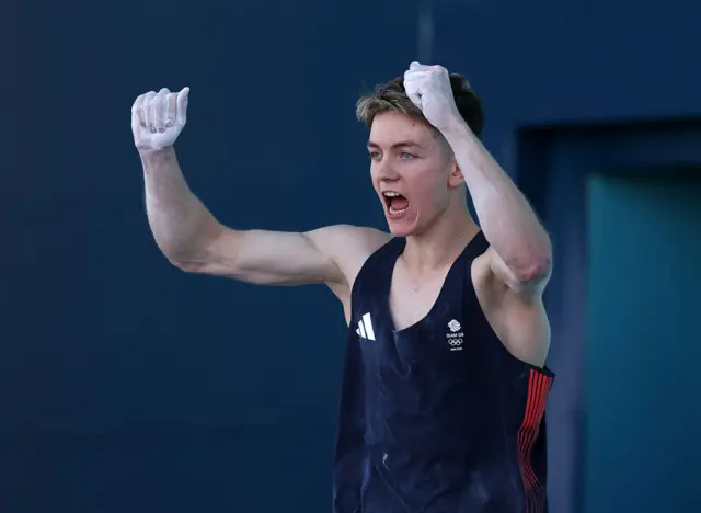 Great Britain's Toby Roberts celebrates his climb