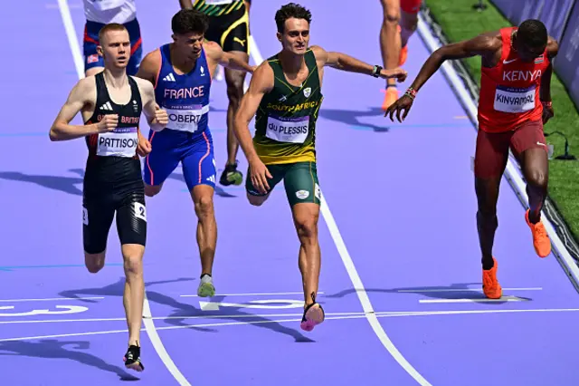 Britain's Ben Pattison, France's Benjamin Robert, South Africa's Edmund Du Plessis and Kenya's Wyclife Kinyamal cross the finish line