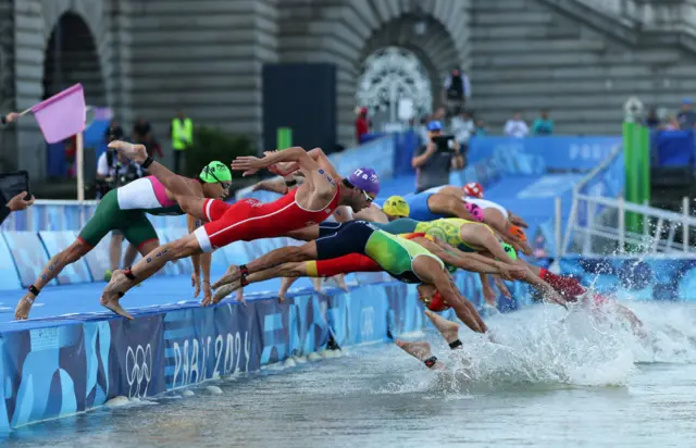 Triathletes swimming in the Seine