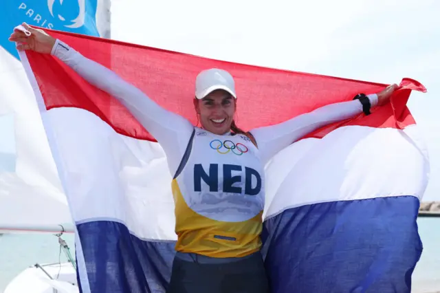 Gold medalist Marit Bouwmeester of Team Netherlands celebrates after the Women's Dinghy medal race