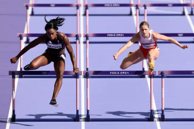 Cindy Sember competing in her 100m hurdles heat