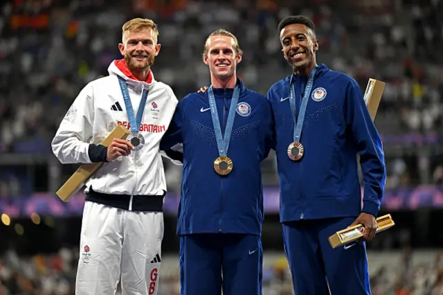 Silver medallist Britain's Josh Kerr (L), gold medallist US' Cole Hocker (C) and bronze medallist US' Yared Nuguse celebrate