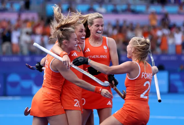 Netherlands celebrate winning a goal in the women's hockey semi-final