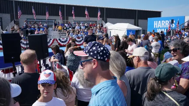 Supporters wait for Harris and Walz