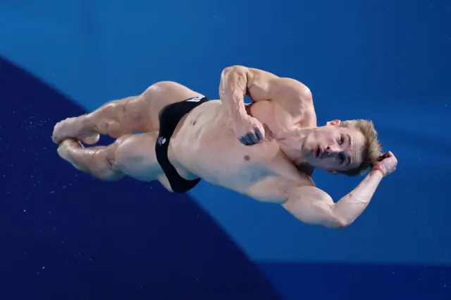 Great Britain's Jack Laugher twisting in the air during a dive