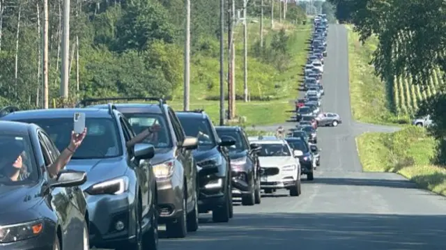 Cars in line ahead of Eau Claire campaign rally