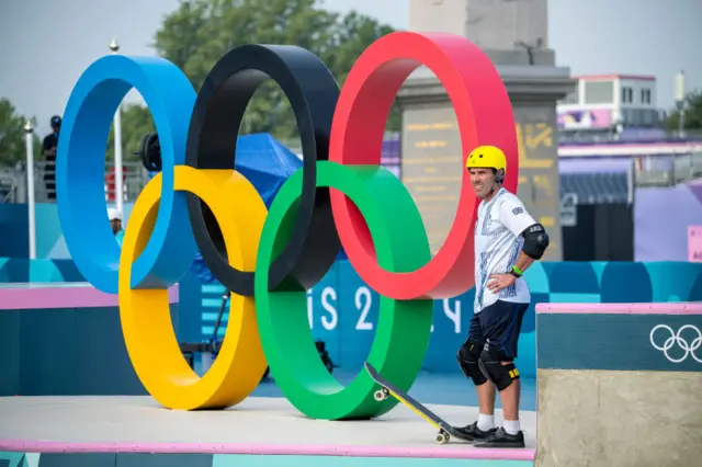 Andy Macdonald in training with the Olympic rings in the background