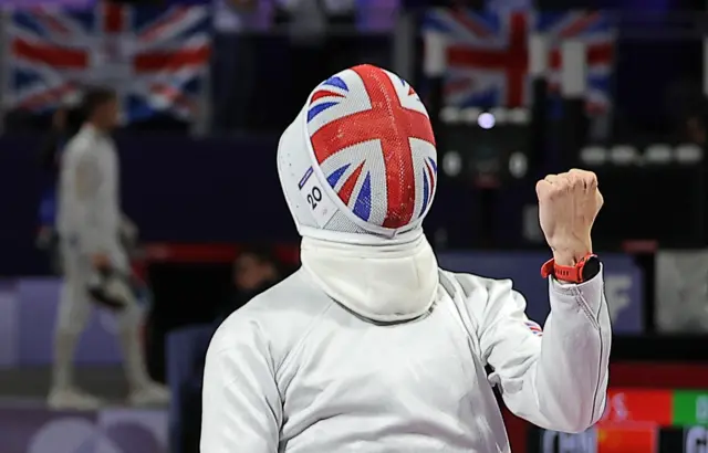 Charles Brown of Britain celebrates his win over Jean-Baptiste Mourcia of France