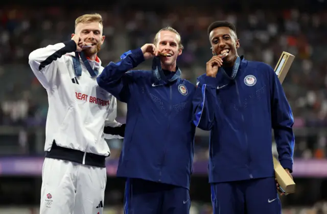 Gold medalist Cole Hocker of Team United States (C), Silver medalist Josh Kerr of Team Great Britain (L) and Bronze medalist Yared Nuguse of Team United States (R)