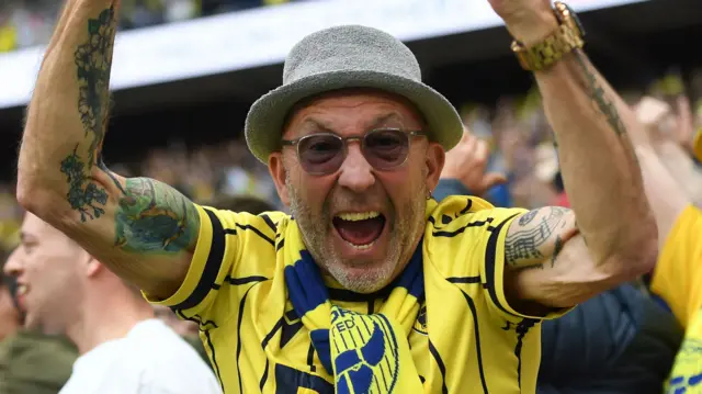 Oxford United fan celebrates