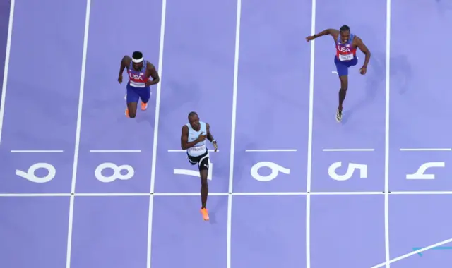Letsile Tebogo of Team Botswana crosses the finish line to win the gold medal in the Men's 200m Final