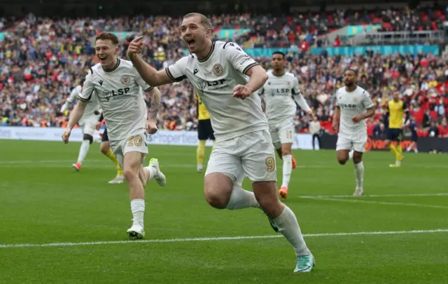 Michael Cheek celebrates after scoring in the National League promotion final for Bromley