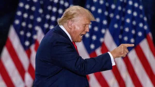 Republican presidential nominee and former U.S. President Donald Trump gestures during a rally with his vice presidential running mate U.S. Senator JD Vance in St. Cloud, Minnesota, U.S., July 27, 2024.