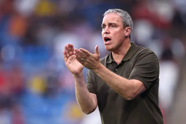 Huddersfield boss Michael Duff claps his hands