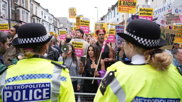 Demonstrators and police officers in Walthamstow