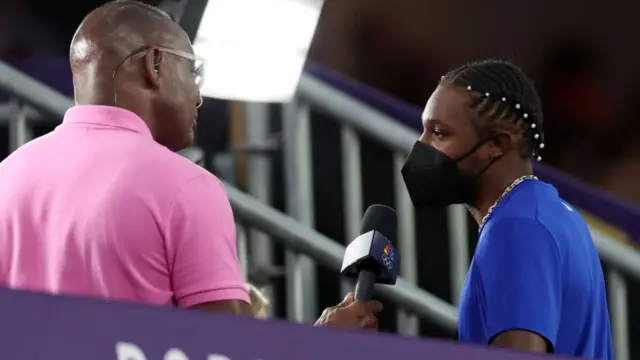 Noah Lyles gives interview with a mask on