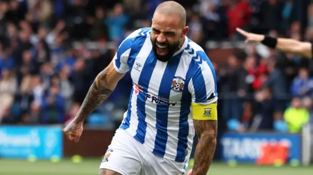Vassell celebrates