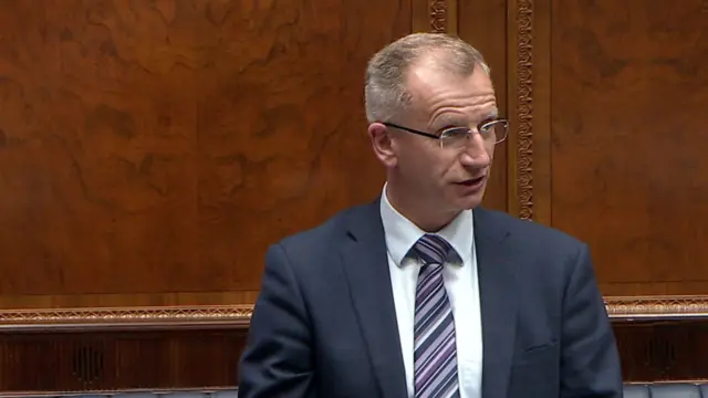 Brian Kingston stand sin the chamber