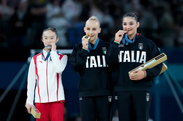 Silver medalist Zhou Yaqin of China (L), gold medalist Alice D'Amato of Italy (C) and bronze medalist Manila Esposito of Italy (R) during the ceremony after the Women's Balance Beam Final