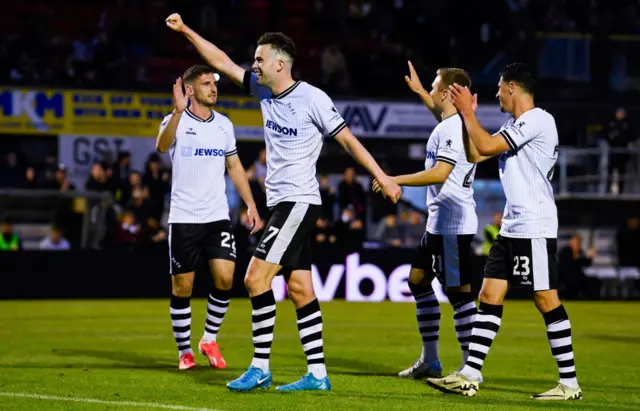 Ayr's Anton Dowds (C) celebrates scoring a penalty to make it 5-0 with teammates (L-R) Mark McKenzie, Ethan Walker and Marco Rus during a William Hill Championship match between Ayr United and Airdrieonians at Somerset Park, on August 09, 2024, in Ayr, Scotland. (Photo by Rob Casey / SNS Group)