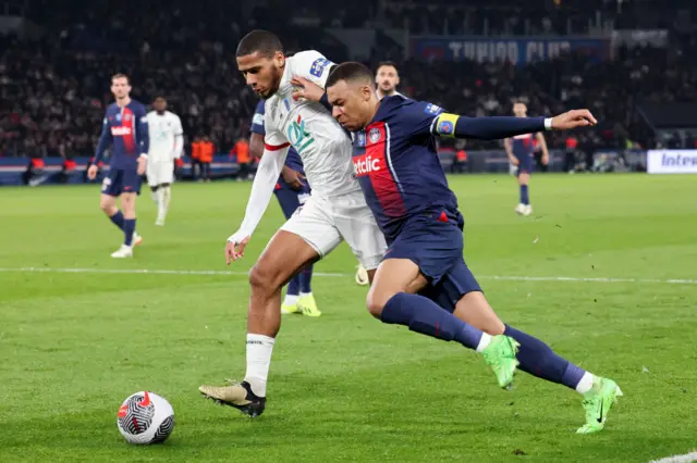 Jean-Clair Todibo challenges Paris St-Germain's Kylian Mbappe while playing for Nice