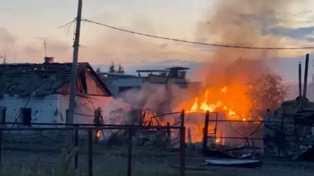 A burning house in Sudzha on Thursday