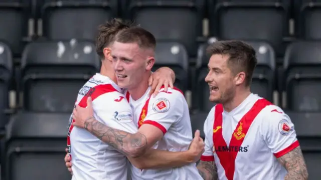 Airdrie's Dylan MacDonald celebrates with player manager Rhys McCabe after scoring to make it 1-0 during a William Hill Championship match between Airdrieonians and Raith Rovers at the Albert Bartlett Stadium, on August 03, 2024, in Airdrie, Scotland