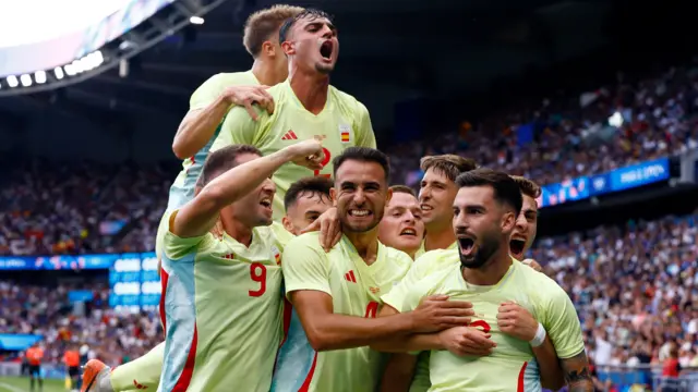 Spain players celebrate after Alex Baena scores against France during the men's football final at the Paris 2024 Olympics