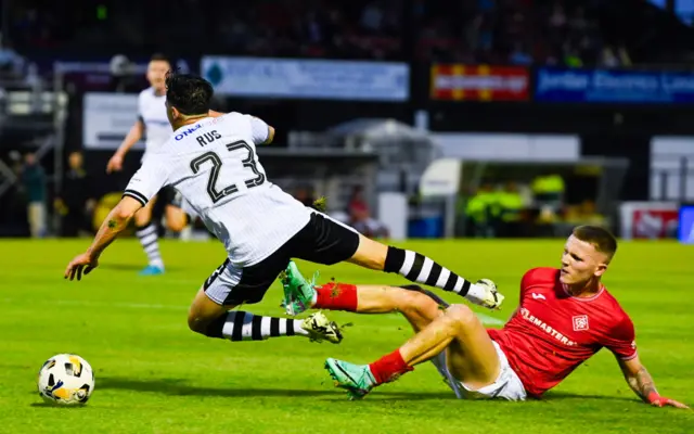 Airdrie's Dylan MacDonald fould Ayr's Marco Rus inside the box conceding a penalty during a William Hill Championship match between Ayr United and Airdrieonians at Somerset Park, on August 09, 2024, in Ayr, Scotland. (Photo by Rob Casey / SNS Group)