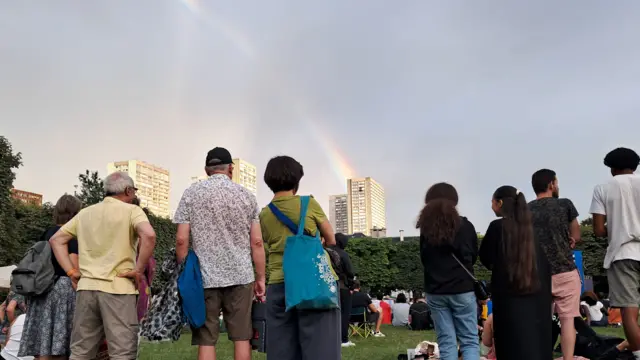 A rainbow forms over a French Olympic fan park