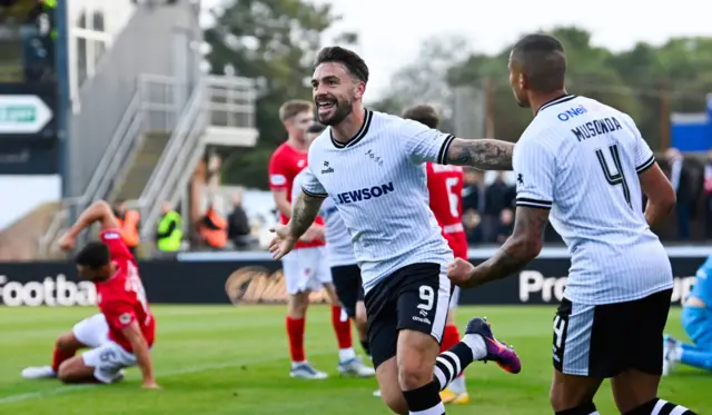 Ayr's George Oakley (C) celebrates scoring to make it 2-0 with teammate Frankie Musonda (R) during a William Hill Championship match between Ayr United and Airdrieonians at Somerset Park, on August 09, 2024, in Ayr, Scotland. (Photo by Rob Casey / SNS Group)