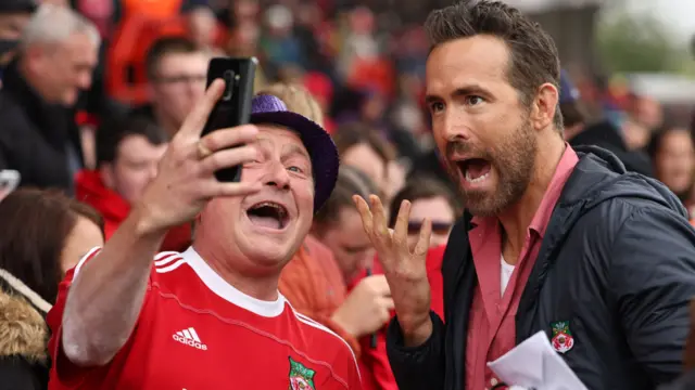 Wrexham co-owner Ryan Reynolds and a fan