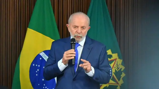 Brazil President Luiz Inácio Lula da Silva speaking into a microphone