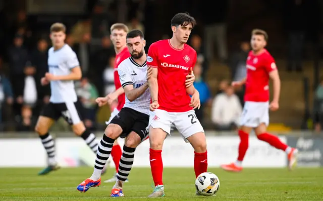 Ayr's Ben Dempsey and Airdrie's Chris Mochrie in action during a William Hill Championship match between Ayr United and Airdrieonians at Somerset Park, on August 09, 2024, in Ayr, Scotland. (Photo by Rob Casey / SNS Group)