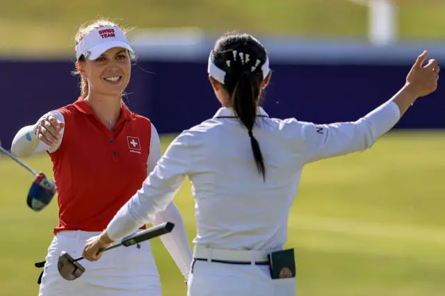 Switzerland's Morgane Metraux embraces New Zealand's Lydia Ko