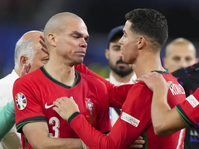 Pepe is consoled by Cristiano Ronaldo