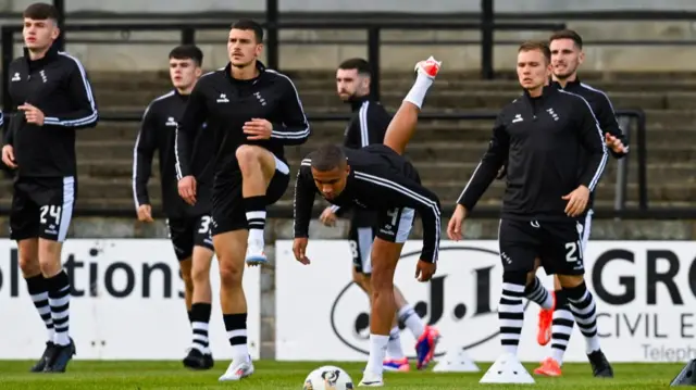 Ayr's Roy Syla (L) and Frankie Musonda (C) pre-match during a William Hill Championship match between Ayr United and Airdrieonians at Somerset Park, on August 09, 2024, in Ayr, Scotland. (Photo by Rob Casey / SNS Group)