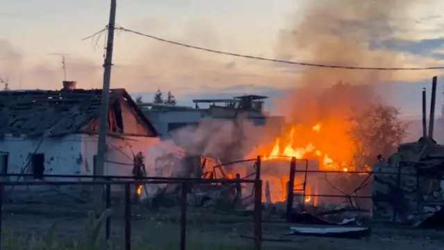 A burning house in the town of Sudzha, in the Kursk region, on Thursday