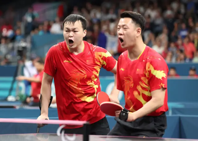 Keli Liao and Shuo Yan celebrate winning a point