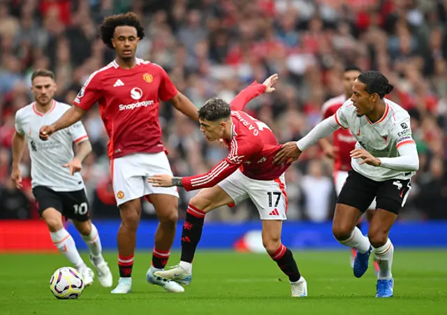 Alejandro Garnacho of Manchester United is challenged by Virgil van Dijk