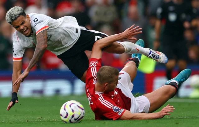 Luis Diaz in action with Manchester United's Matthijs de Ligt